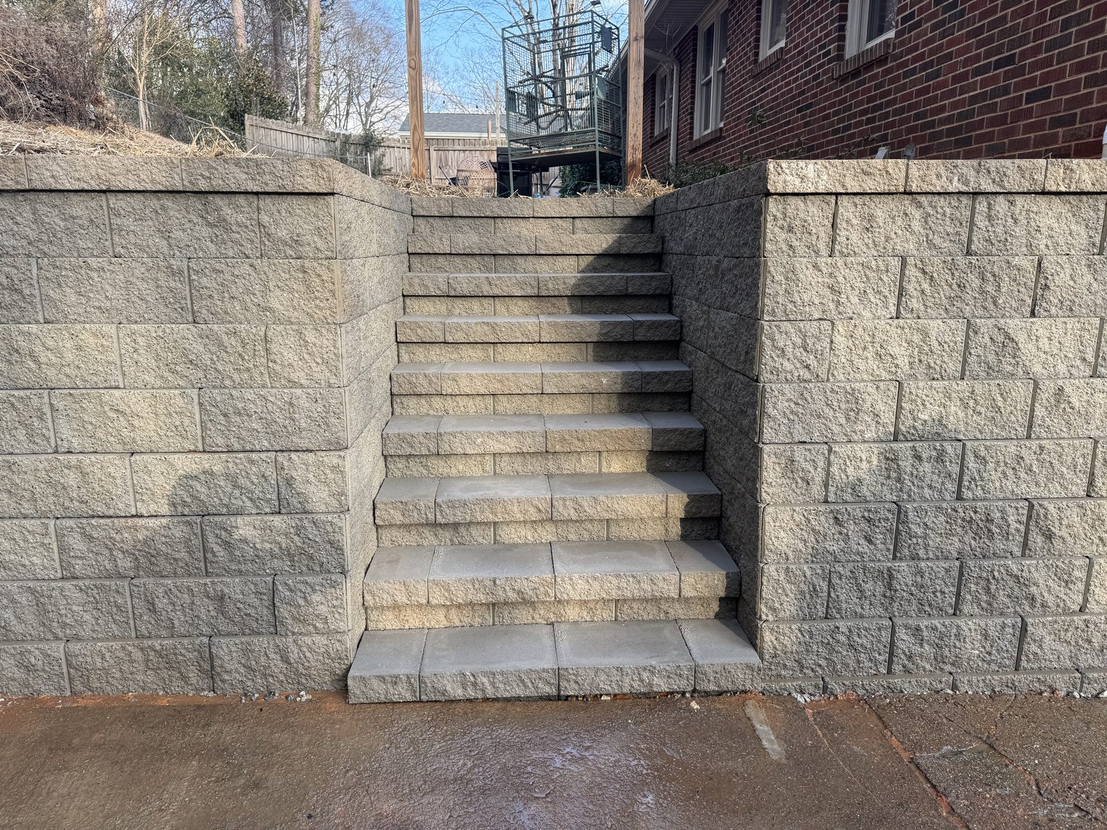 Stone steps between finished retaining walls