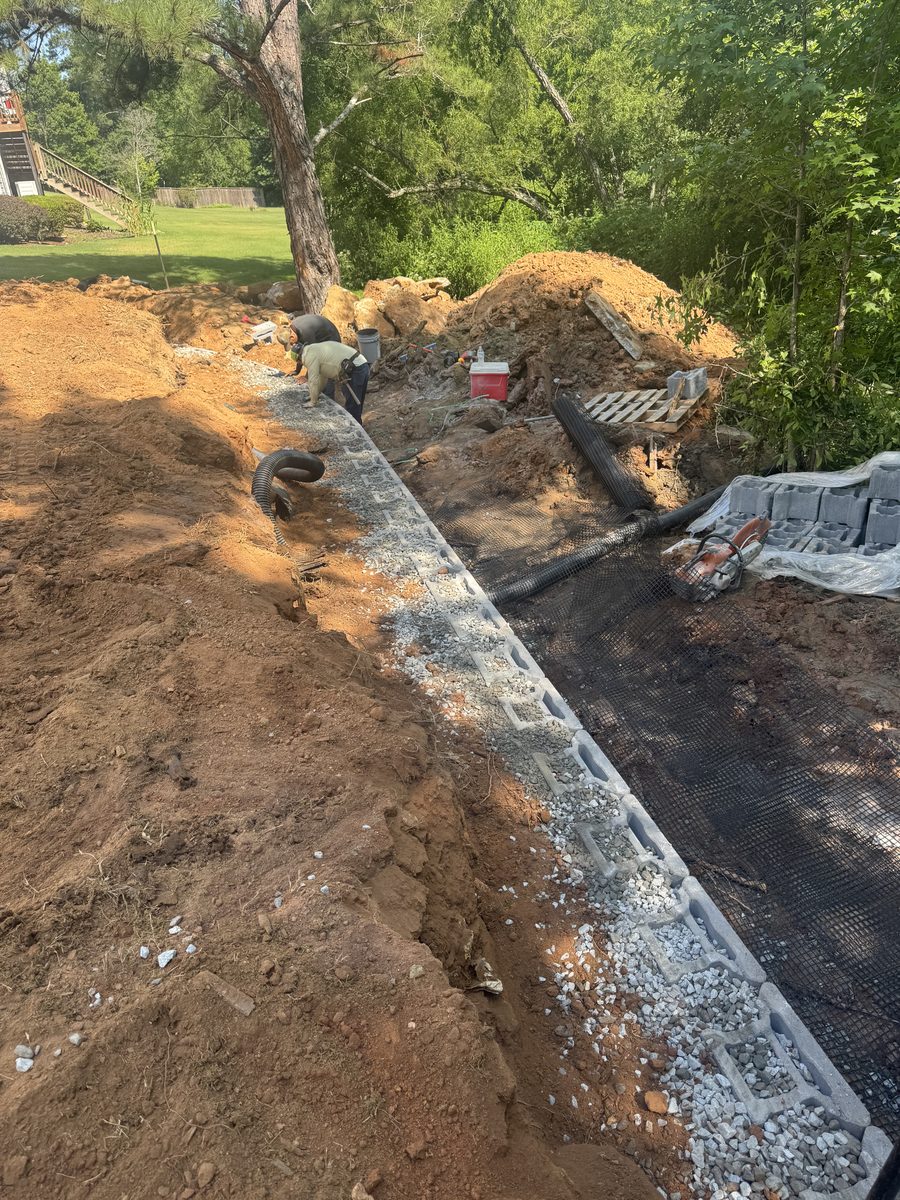 Drainage trench with gravel and landscape fabric